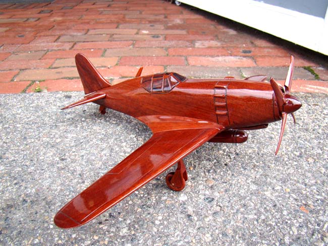 A beautiful carved mahogany depiction of a World War II fighter plane, possibly a Grumman Hellcat F6F — image 2
